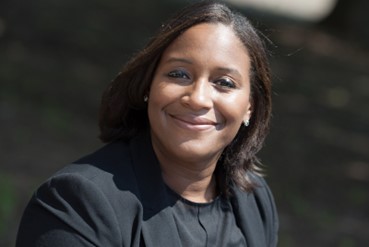 Smiling Female in a black shirt  and black sweater