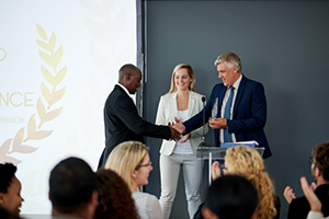 Photograph of individual receiving an award.