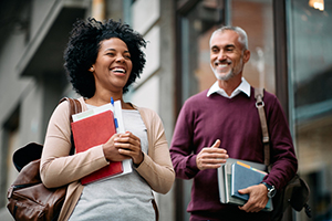 Two non-traditional adult learners walking to class.