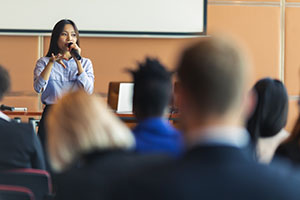 Individual giving a presentation.