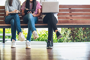 Photograph of students working on a bench.