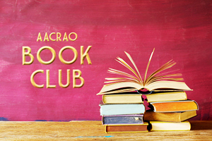 pinkish-red background with a stack of books and the text "AACRAO Book Club" displayed 