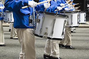 University marching band drum team on parade.
