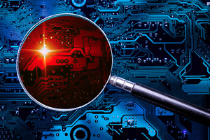 magnifying glass with red lens is on top of a blue computer chip background