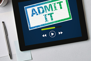 mobile tablet device with the text "admit it" displayed