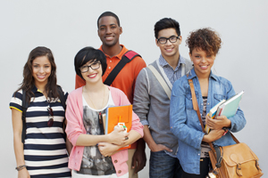 diverse group of students smile together for a photo