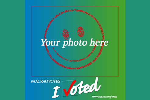 smiley face drawn in red with the text overlay, "your photo here", and the bottom of the image says "#AACRAOVOTES" "I voted"