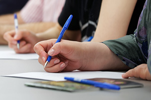 Photograph of individuals completing a survey.