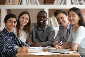 diverse group of students sitting around a table