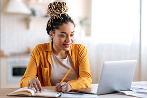 Young woman taking an online course.