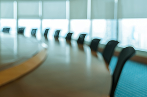 Board room with empty chairs.