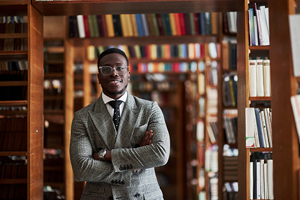 professor standing in library