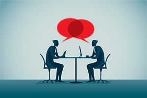 two illustrated figures sitting across from one another at a table with red speech bubbles coming from both