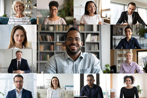 split screen showing 13 smiling coworkers on a video call