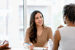 Individuals conducting an interview.