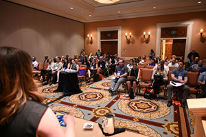 photo taken from the perspective of a presenter speaking to an audience members