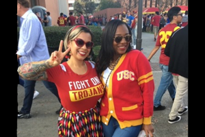 two females in USC gear pose for a photo together