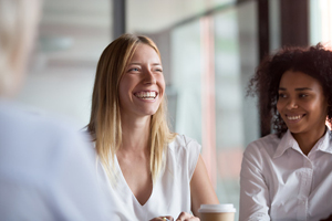 two businesswomen smiling