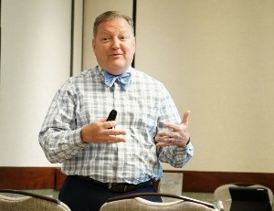 Photo of Jack Miner wearing a baby blue bow tie as he is presenting.