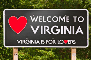 "Welcome to Virginia" road sign featuring a red heart next to the white lettering.