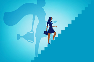 Cartoon business women walking up a set of stairs with her shadow showing her wearing a cape and carrying a trophy.