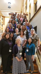 2017 group photo of AACRAO staff and members posing on a staircase.