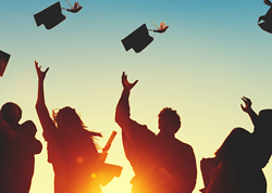 Silhouettes wearing graduation gowns as they throw their caps into the air in a display of celebration.