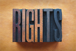 Wooden stamp of the word "rights".