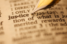 Photo of dictionary page focused in on the word justice.