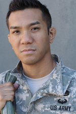 Headshot of a male wearing army fatigues. 