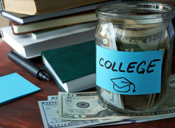 Stack of books with a jar of money labeled "college" visible in front of the books.