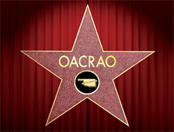 Red stage curtain with a Hollywood star in front of it that says "OACRAO".