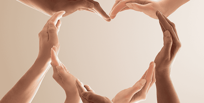 Hands forming a heart shape around an empty center