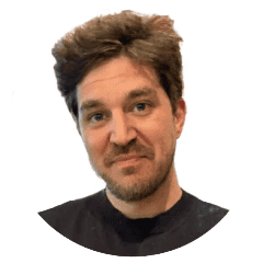 Portrait of a man with dark hair and a short beard on a white background