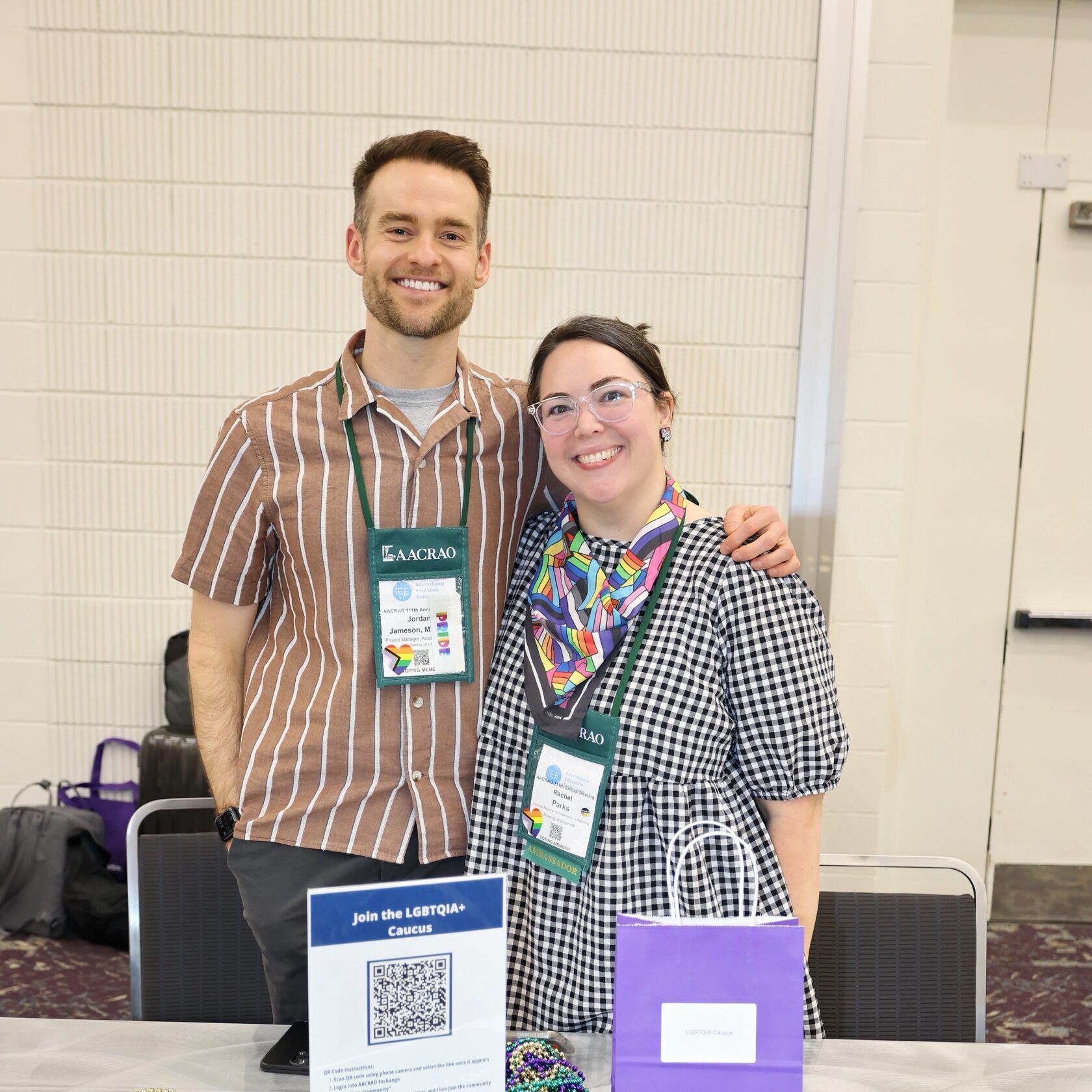 Two members at the AACRAO LGBTQIA+ Caucus table