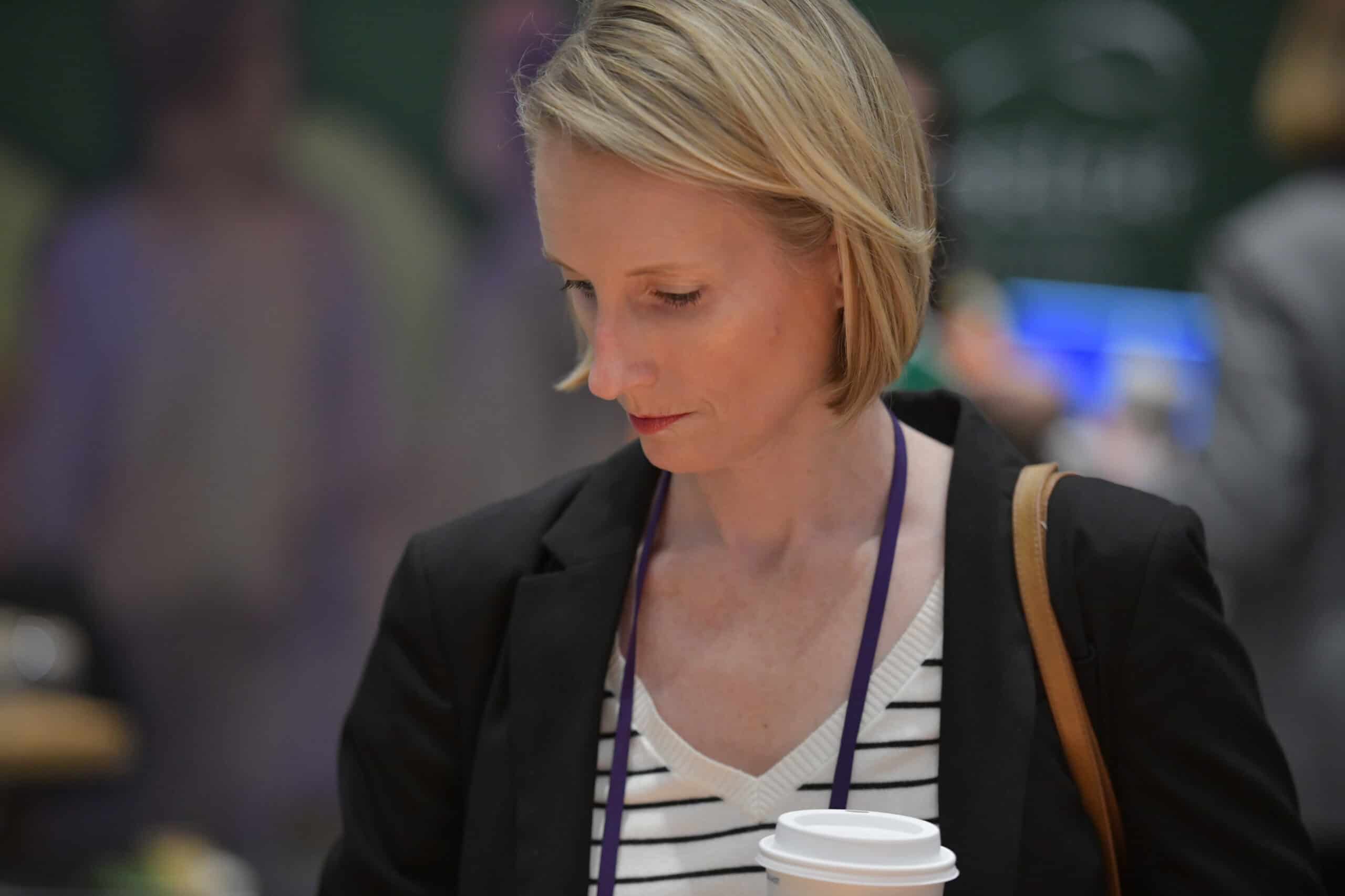 AACRAO Member at event wearing a dark blue blazer
