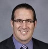 headshot of John P. Panzica