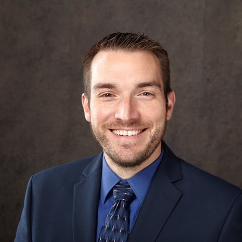 Portrait of a smiling man in a suit and tie