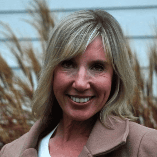 Portrait of a smiling blonde woman outdoors