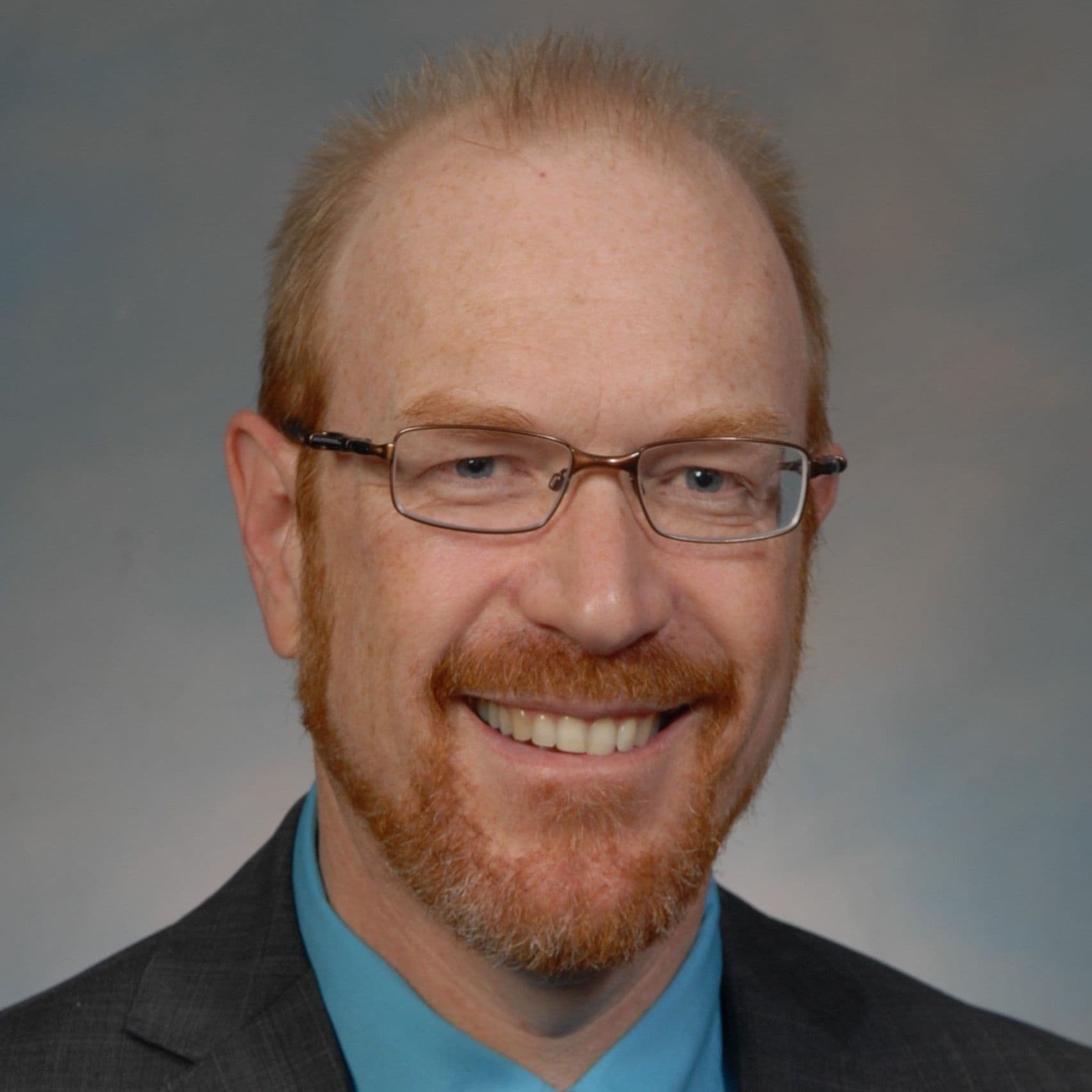 Headshot of Ken Sharp.