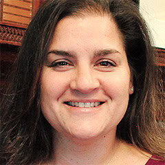 Portrait of a smiling woman with long dark hair