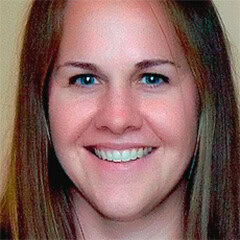 Portrait of a smiling woman with light brown hair