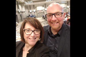 two people pose for a selfie together