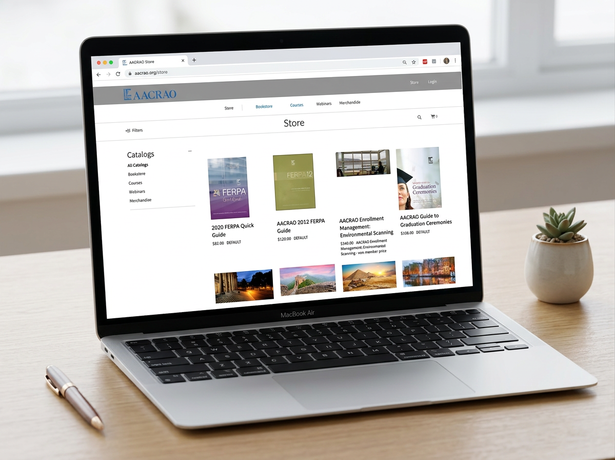 laptop on a clean desk showcasing AACRAO Bookstore website