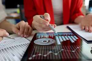 Professionals reviewing data analytics.