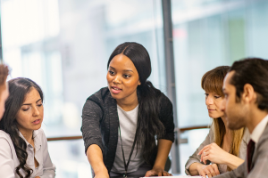 Group of professionals meeting at a table.