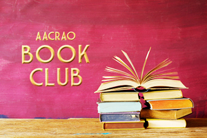 pinkish-red background with a stack of books and the text "AACRAO Book Club" displayed