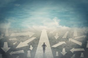figure walks down a straight line with many other lines chaotically scattered to either side of the straight line