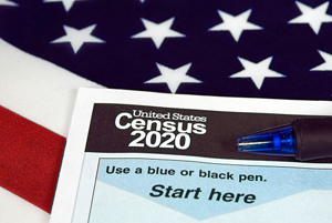 American flag with the 2020 Census booklet on top