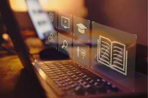 Sunset glow over a keyboard and monitor with tech icons